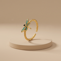Green enamel dragonfly on a twisted rope band, gold-toned adjustable ring