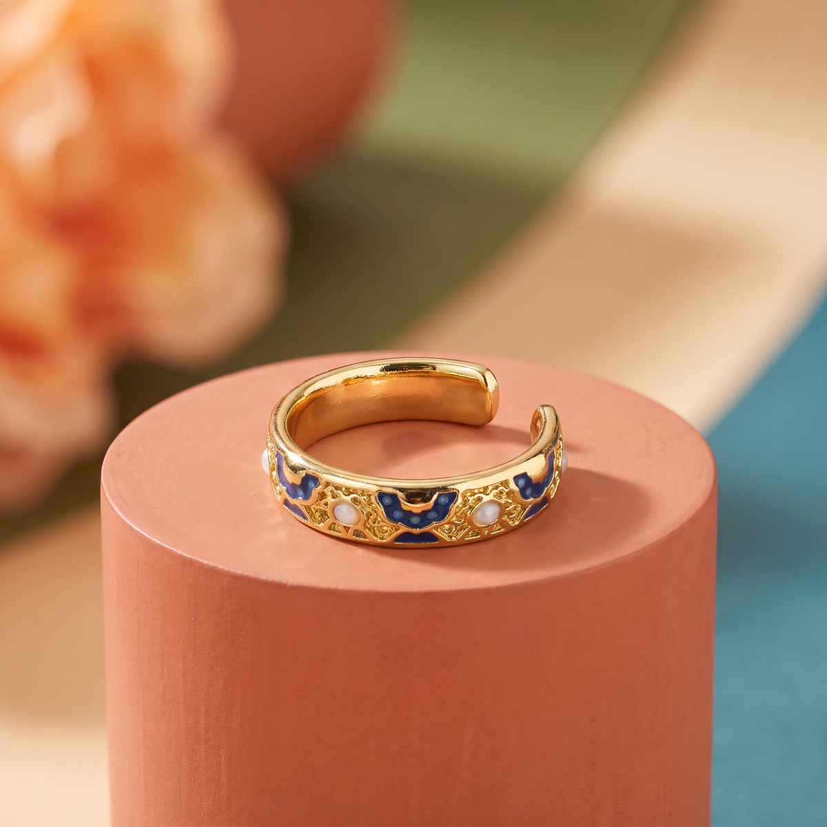 Navy enamel filigree band with pearl accents, antique gold-toned adjustable ring