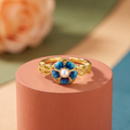 Blue enamel flower ring with pearl centre, antique gold-toned adjustable band
